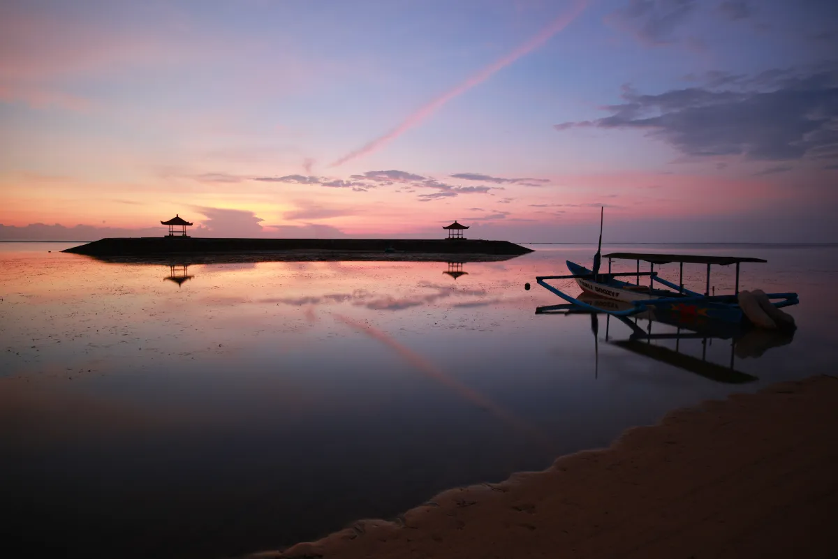 Dawn breaking over the calm water off Sanur beach